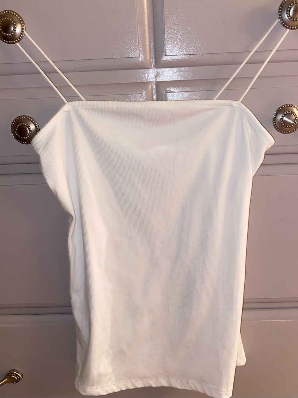 White ribbed cami top with elasticized straps. Size M
